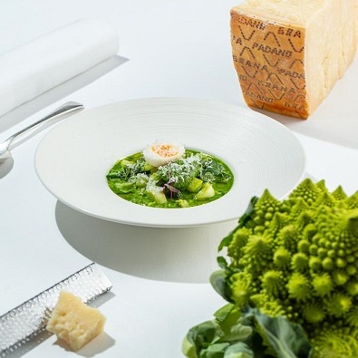 Spring green vegetables, Grana Padano and basil soup