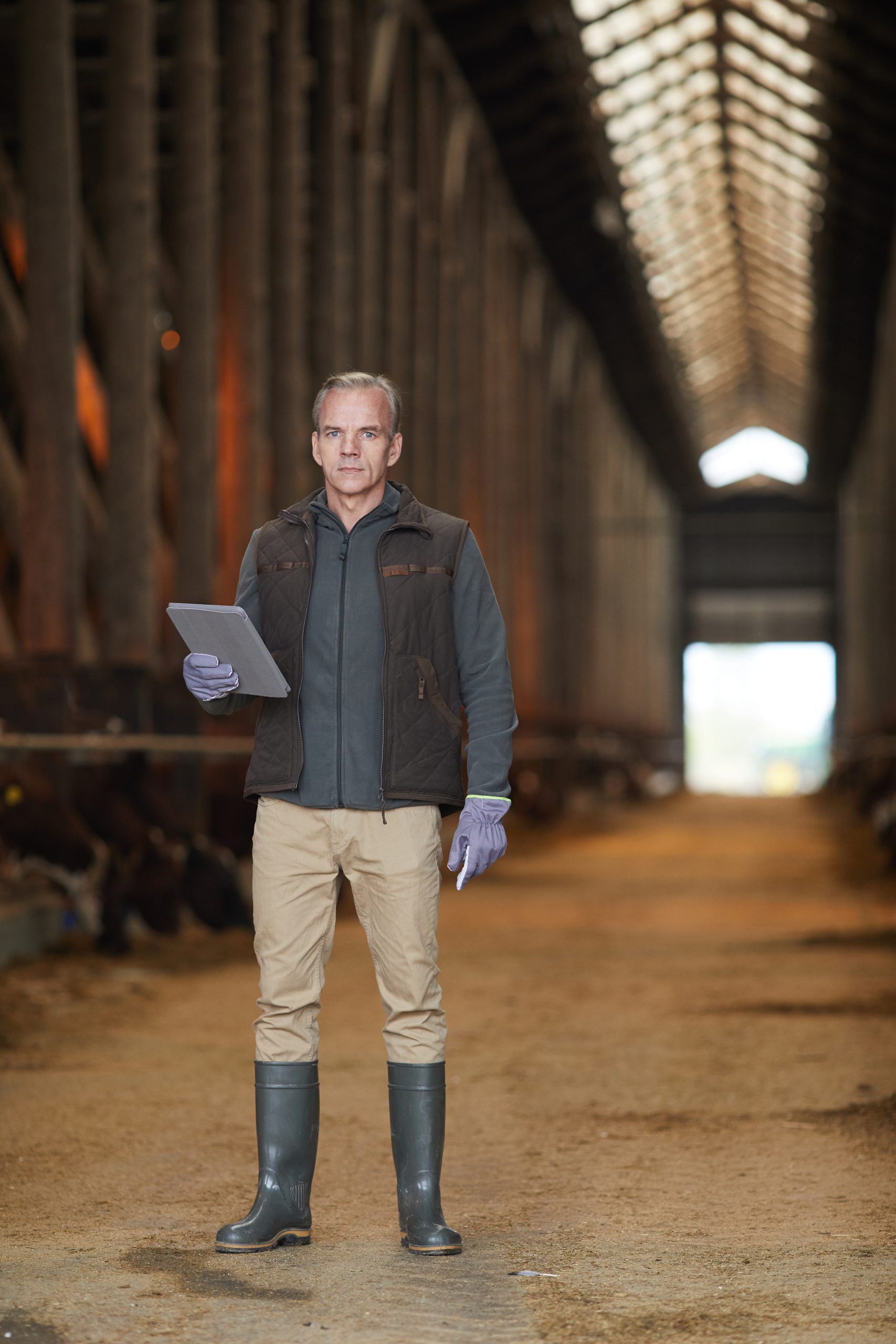 Mature Farm Owner Holding tablet