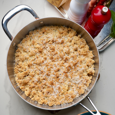 Grana Padano crumble with pears and caramelized shallots